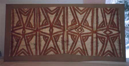 A tapa, mounted for display.